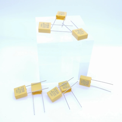 خازن کاهش فشار مقاومتی و خازنی 0.1UF 310V P7.5MM رنگ زرد